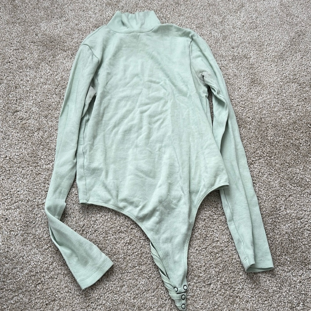 Mint green bodysuit.